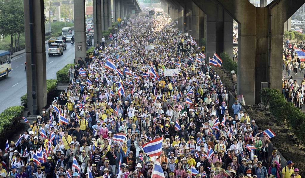 File photo of anti-government protesters marching in Bangkok in December, 2013. Photo: Reuters