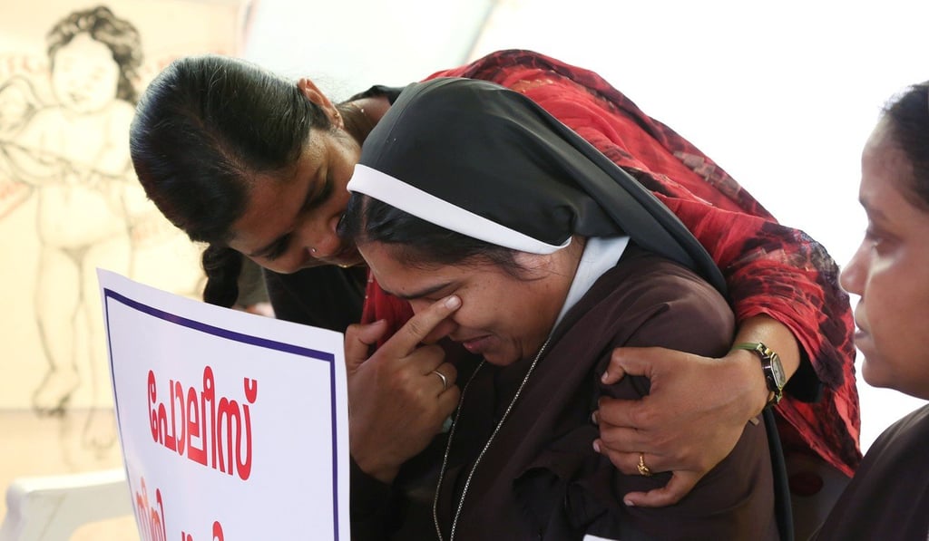 A woman consoles a nun during a protest demanding justice after an alleged sexual assault of a nun by a bishop in Kochi, in the southern state of Kerala, India. Photo: Reuters