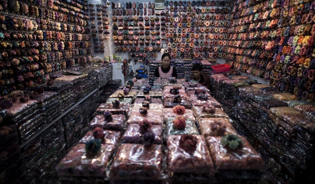 A vendor at a wholesale market in Yiwu, Zhejiang province. The UN describes Yiwu as “the world’s largest wholesale market of general merchandise”. Photo: AFP
