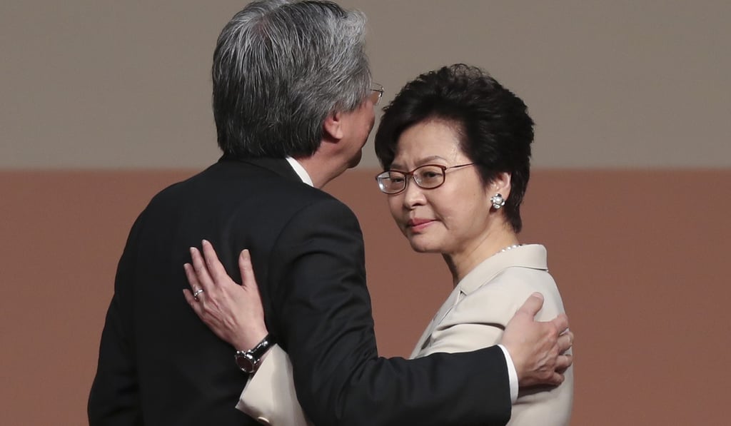 Chief executive election candidates John Tsang and Carrie Lam embrace as results are announced. Photo: Robert Ng