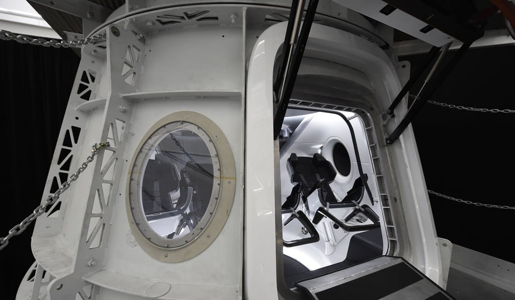 In this file photo taken on August 13, 2018, the SpaceX Crew Dragon simulator is show to the media during a press tour at SpaceX headquarters in Hawthorne, California. Photo: Agence France-Presse