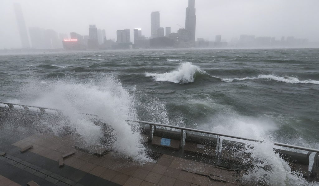 Waves pound the harbourfront at Central as Typhoon Hato sends the city into high alert. Photo: Nora Tam