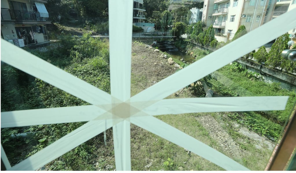 Village house windows are taped before Typhoon Mangkut arrives. Photo: Winson Wong
