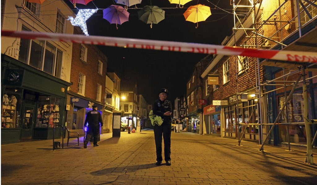 A police officer behind a cordon on the High Street in Salisbury after two people were taken ill from at Prezzo restaurant. Photo: AP A police officer behind a cordon on the High Street in Salisbury after two people were taken ill from at Prezzo restaurant. Photo: AP