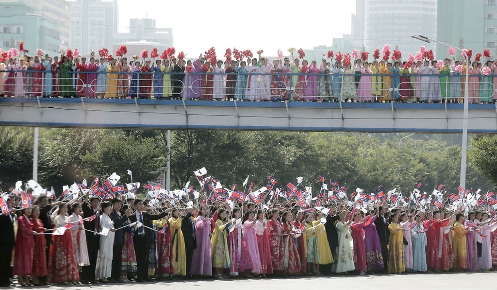 North Koreans lining the streets of Pyongyang to greet South Korean President Moon Jae-in. Photo: Kyodo