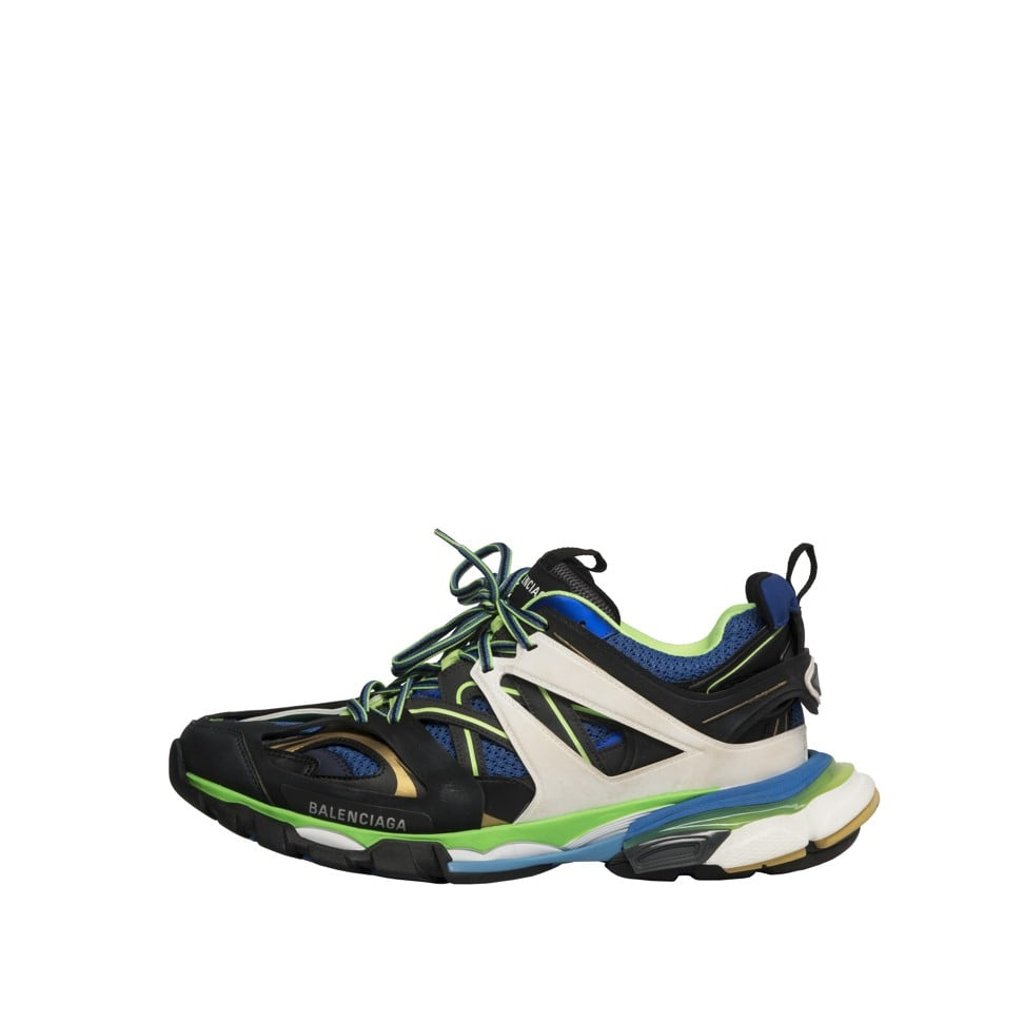 Balenciaga. The new oversized “Track Trainers” from the brand’s 2018 winter show are embossed with a BB logo at the front and a Track logo at the back. Inspired by running and hiking shoes, the sneakers features a layered effect. Price on request