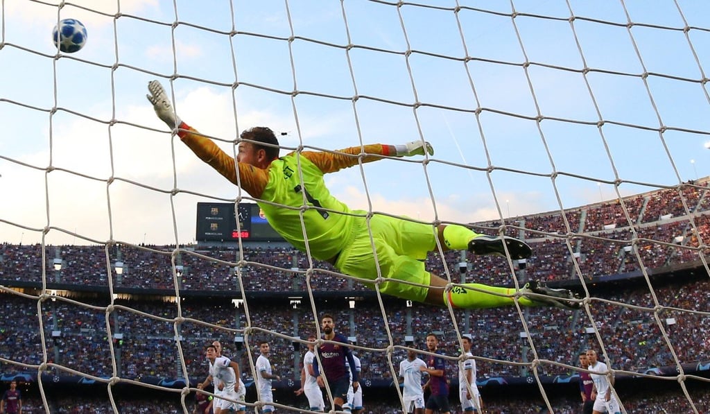 Messi’s free kick finds the top corner of the net. Photo: Reuters