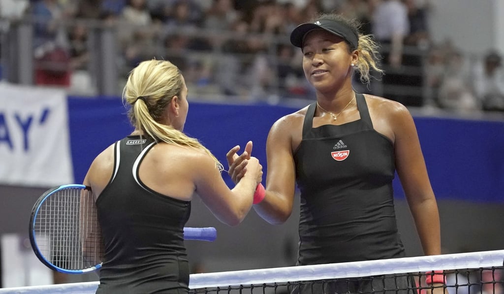 Naomi Osaka shakes hands with Dominika Cibulkova after their match. Photo: AFP
