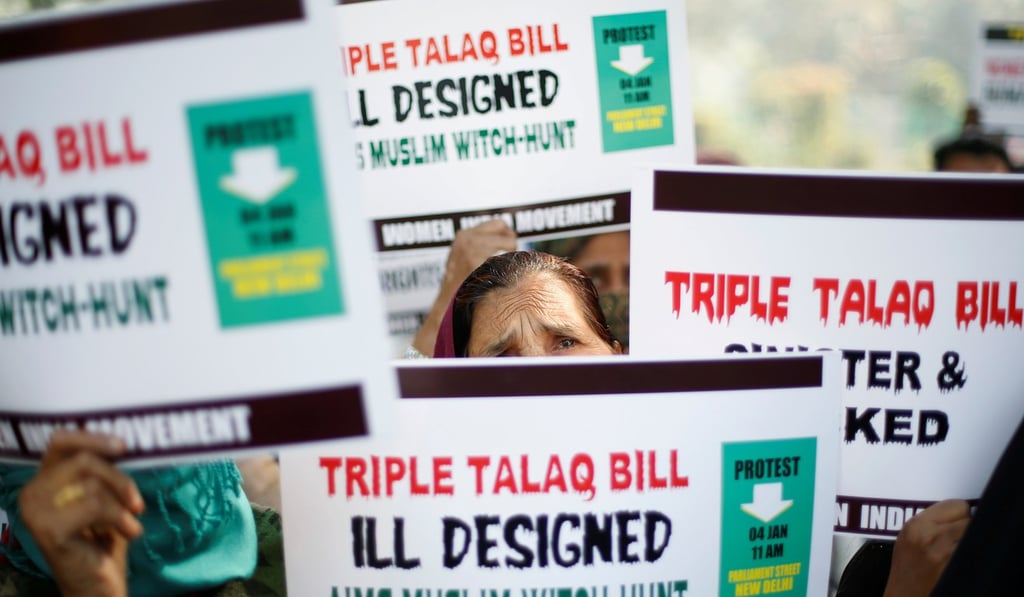 Muslim women hold placards during a protest against a bill outlawing “triple talaq,” or instant divorce, in New Delhi. Photo: Reuters