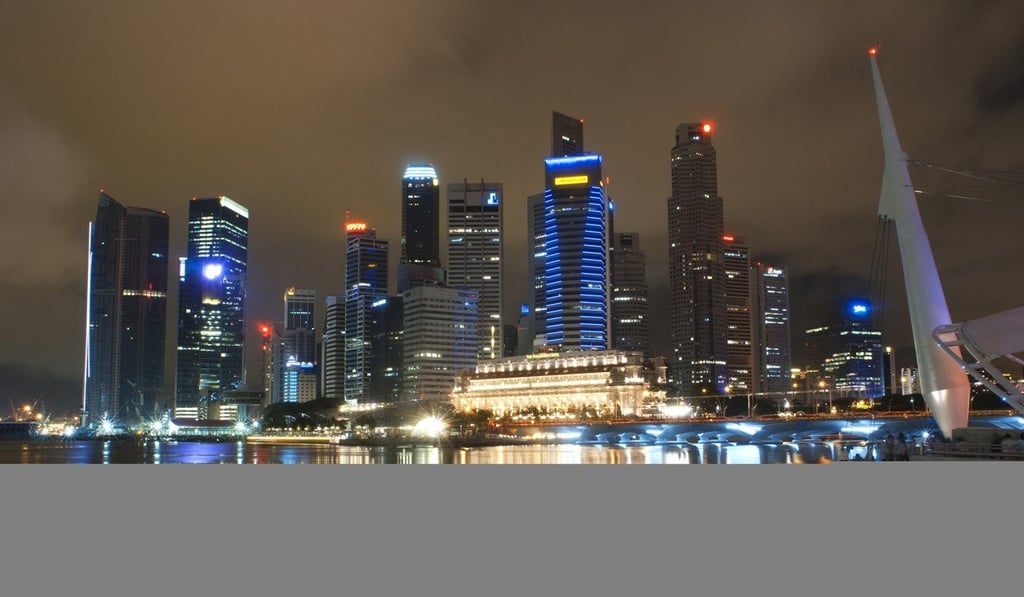 Singapore’s financial district at dusk. Photo: TNS