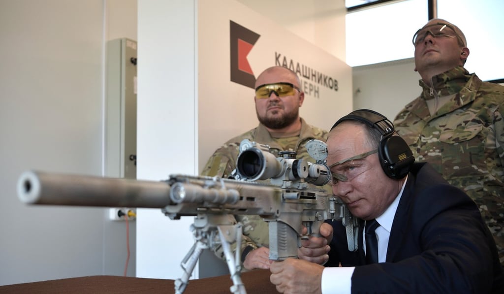 Russian President Vladimir Putin aims a Chukavin sniper rifle at a firing range outside Moscow, on Wednesday. Photo: Reuters
