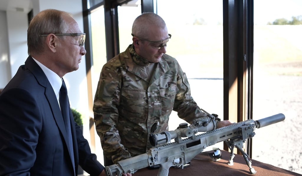 Russian President Vladimir Putin prepares to shoot a Chukavin sniper rifle outside Moscow on Wednesday. Photo: Reuters