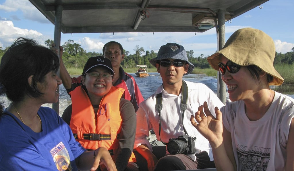 Scholar Hezri Adnan (second from the right) doing field work in Tasik Chini, Malaysia. Photo: Shamil Norshidi