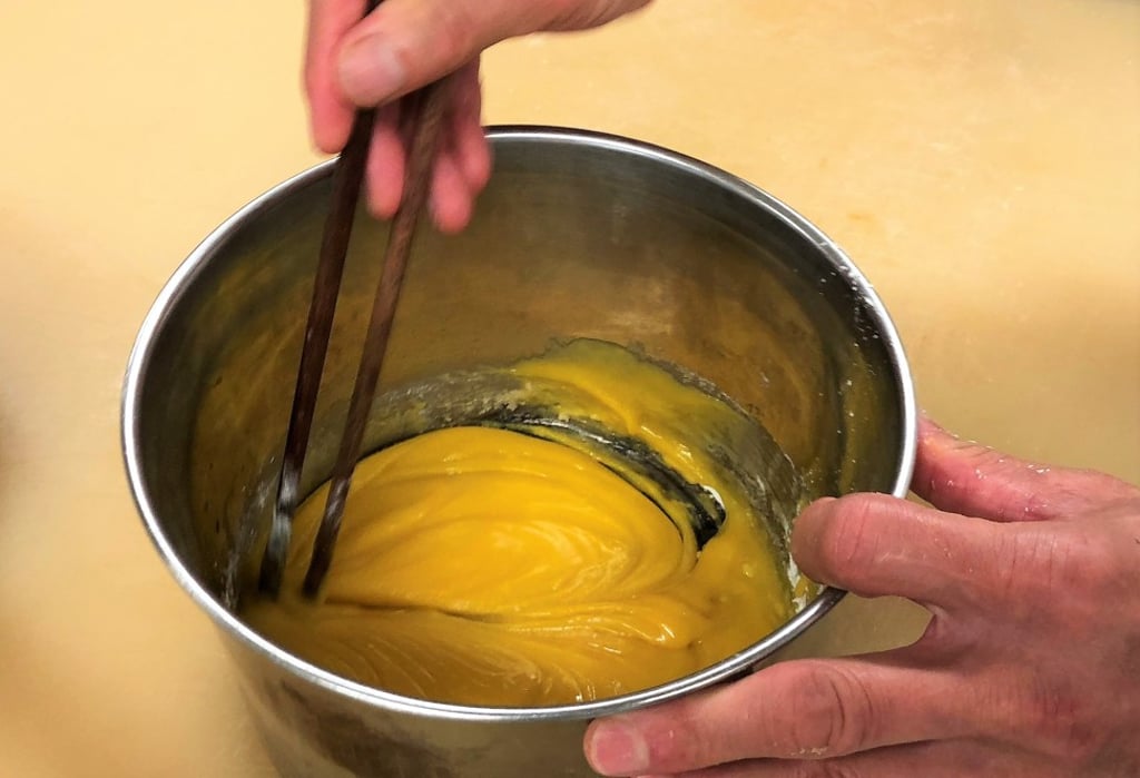 Making the creamy filling for the mooncakes. Filling ingredients include whipped cream, milk powder, flour, custard powder, butter and salted egg yolk.