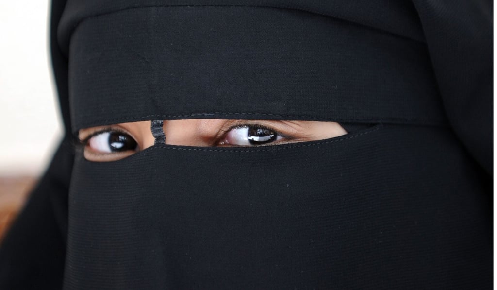 A 2010 file picture shows a Muslim woman wearing the niqab, a veil which covers the body and leaves only a small strip for the eyes in Montreuil, outside Paris, ahead of France’s imposition of a ban on full-face head coverings. Photo: Agence France-Presse A 2010 file picture shows a Muslim woman wearing the niqab, a veil which covers the body and leaves only a small strip for the eyes in Montreuil, outside Paris, ahead of France’s imposition of a ban on full-face head coverings. Photo: Agence France-Presse