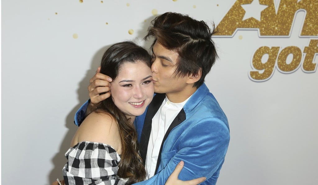 AGT's winner magician Shin Lim, right, kisses his fiancée Casey Thomas at the Dolby Theatre on Wednesday in Los Angeles. Photo: AP AGT's winner magician Shin Lim, right, kisses his fiancée Casey Thomas at the Dolby Theatre on Wednesday in Los Angeles. Photo: AP