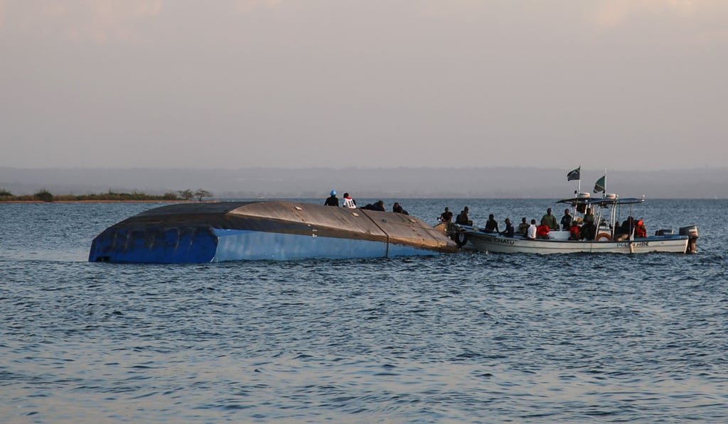 Investigators on the capsized ferry MV Nyerere. Photo: AFP Investigators on the capsized ferry MV Nyerere. Photo: AFP