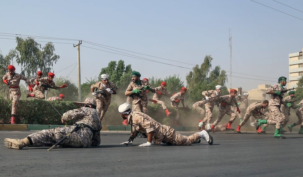 Soldiers run for cover during the attack. Photo: EPA