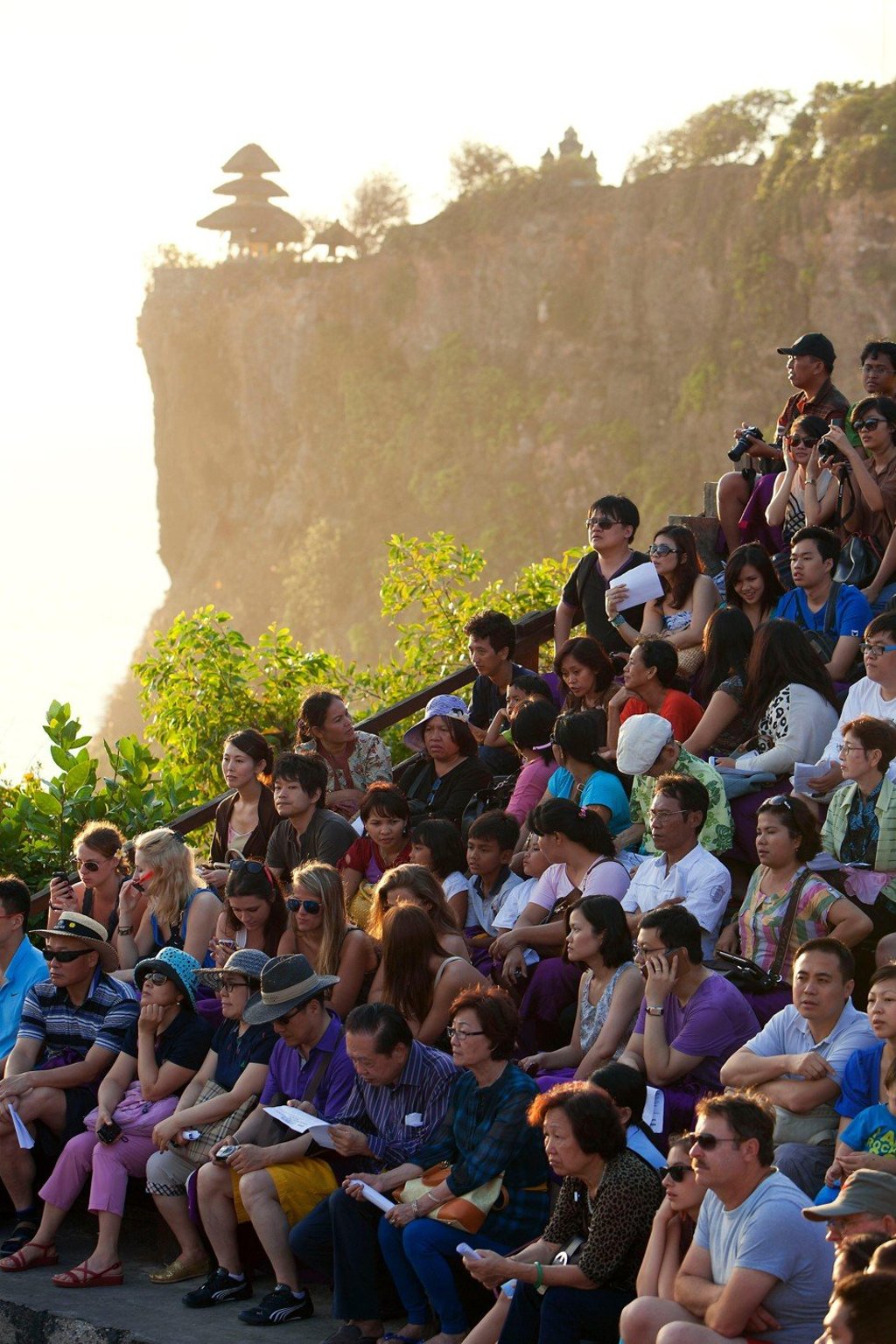 Tourists watch a traditional dance at Bali’s Uluwathu Temple. Photo: Alamy