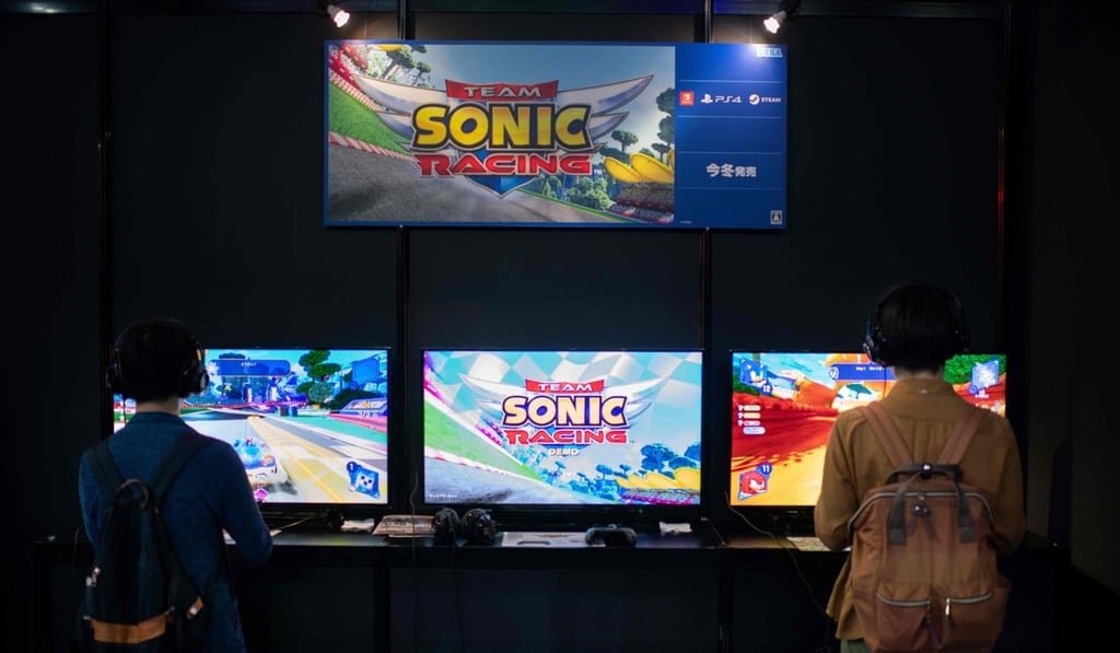 Visitors play video games at the Tokyo Game Show. Photo: AFP