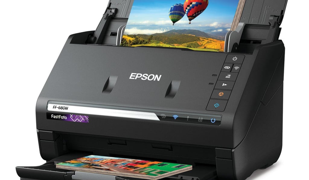 Epson’s new FastFoto FF-680W fast photo scanner, which can auto-feed stacks of up to 36 prints at a time and scan one photo per second.