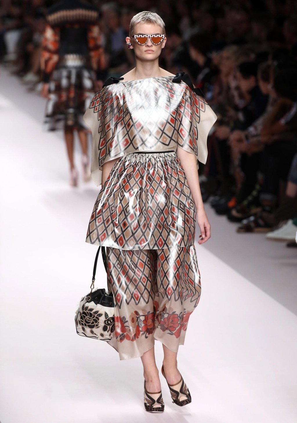 A model presents one of the creations from Fendi’s spring-summer 2019 collection show – which had ‘functionality’ as its focus – at Milan Fashion Week on Thursday. Photo: EPA-EFE A model presents one of the creations from Fendi’s spring-summer 2019 collection show – which had ‘functionality’ as its focus – at Milan Fashion Week on Thursday. Photo: EPA-EFE