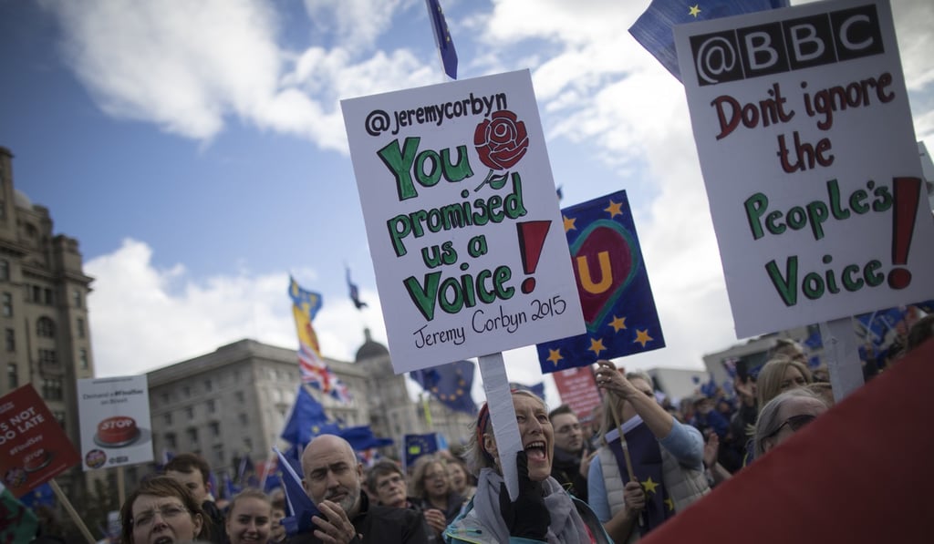 Anti-Brexit protesters march with placards near the annual Labour Conference in Liverpool on Sunday. Photo: Bloomberg