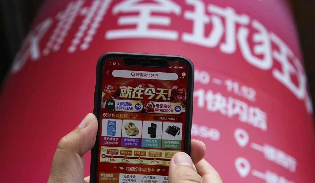A mobile phone screen shows the Taobao app displaying the Singles' Day shopping festival promotion. Taobao has had an ‘image search and buy’ function since 2014. Photo: SCMP.