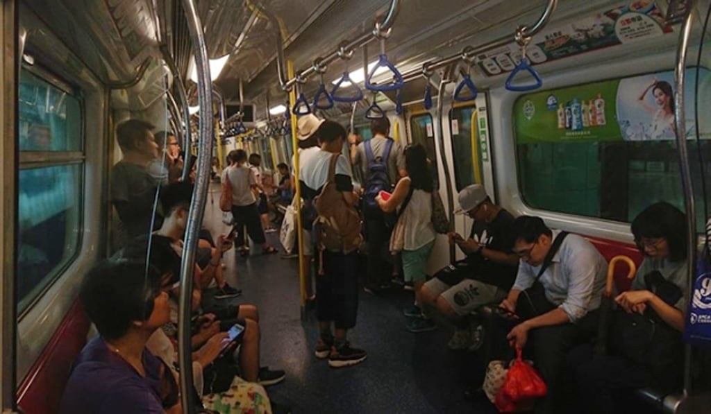 Passengers on one of the halted trains when emergency lighting came on. Photo: Handout