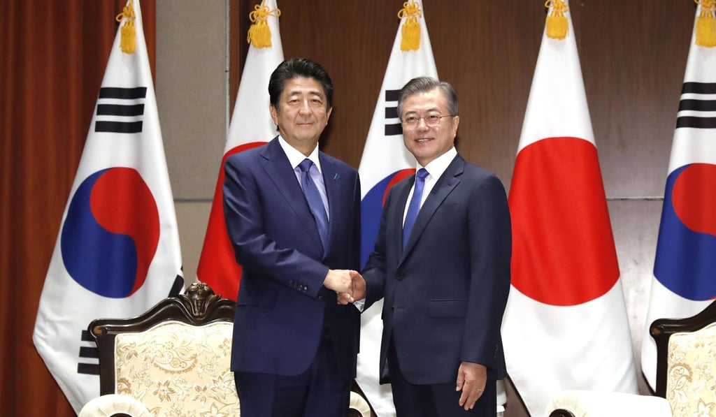Japan’s Prime Minister Shinzo Abe and South Korea’s President Moon Jae-in meeting in New York on September 25, 2018. Photo: Kyodo/AP