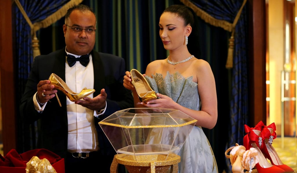 Hemant Karamchandani, CEO of Passion Jewellers and Maria Majari, Creative Director of Jada Dubai unveil the US$17 million shoes. Photo: Reuters