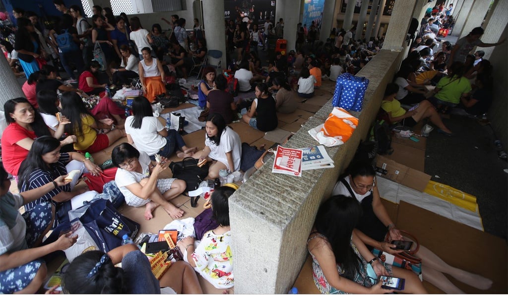 Domestic workers gather in Central on a public holiday. Photo: Edward Wong