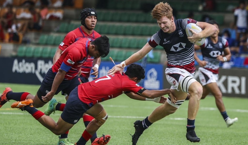 Liam Herbert on the charge against Malaysia at the opening round of the Asian Rugby Seven Series at the Hong Kong Football Club. Photo: Edward Wong