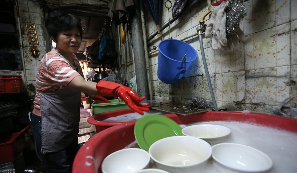 The rise in the minimum wage for workers such as Ah Lai, a dishwasher in a restaurant in Sham Shui Po, will reportedly cost the city’s businesses an extra HK$700 million. Photo: Dickson Lee