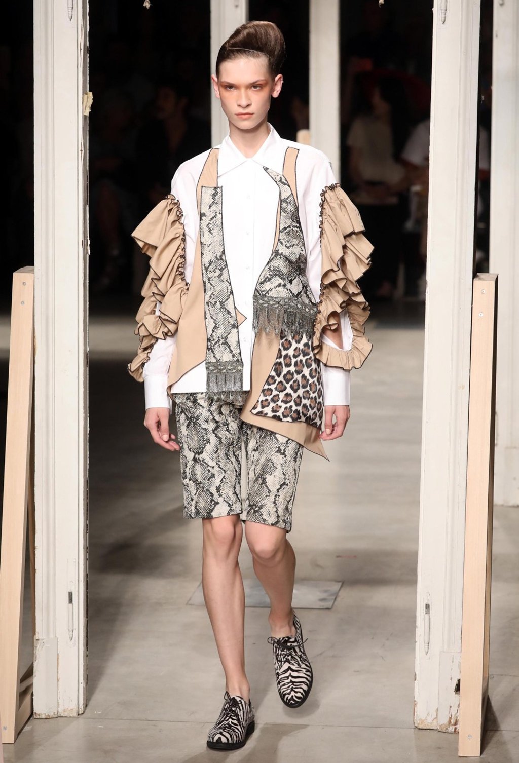 In Antonio Marras’ collection, garments purposely lack a clearly defined silhouette, but have overlays indicating turbulence and forced journeys. Photo: EPA