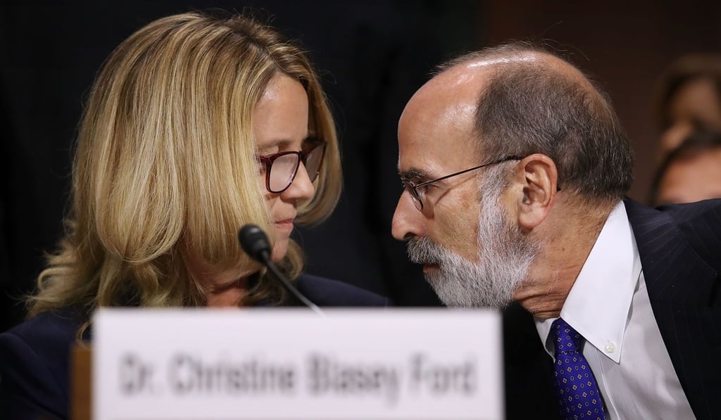 Christine Blasey Ford talks with her lawyer Michael Bromwich during the hearing. Photo: AFP