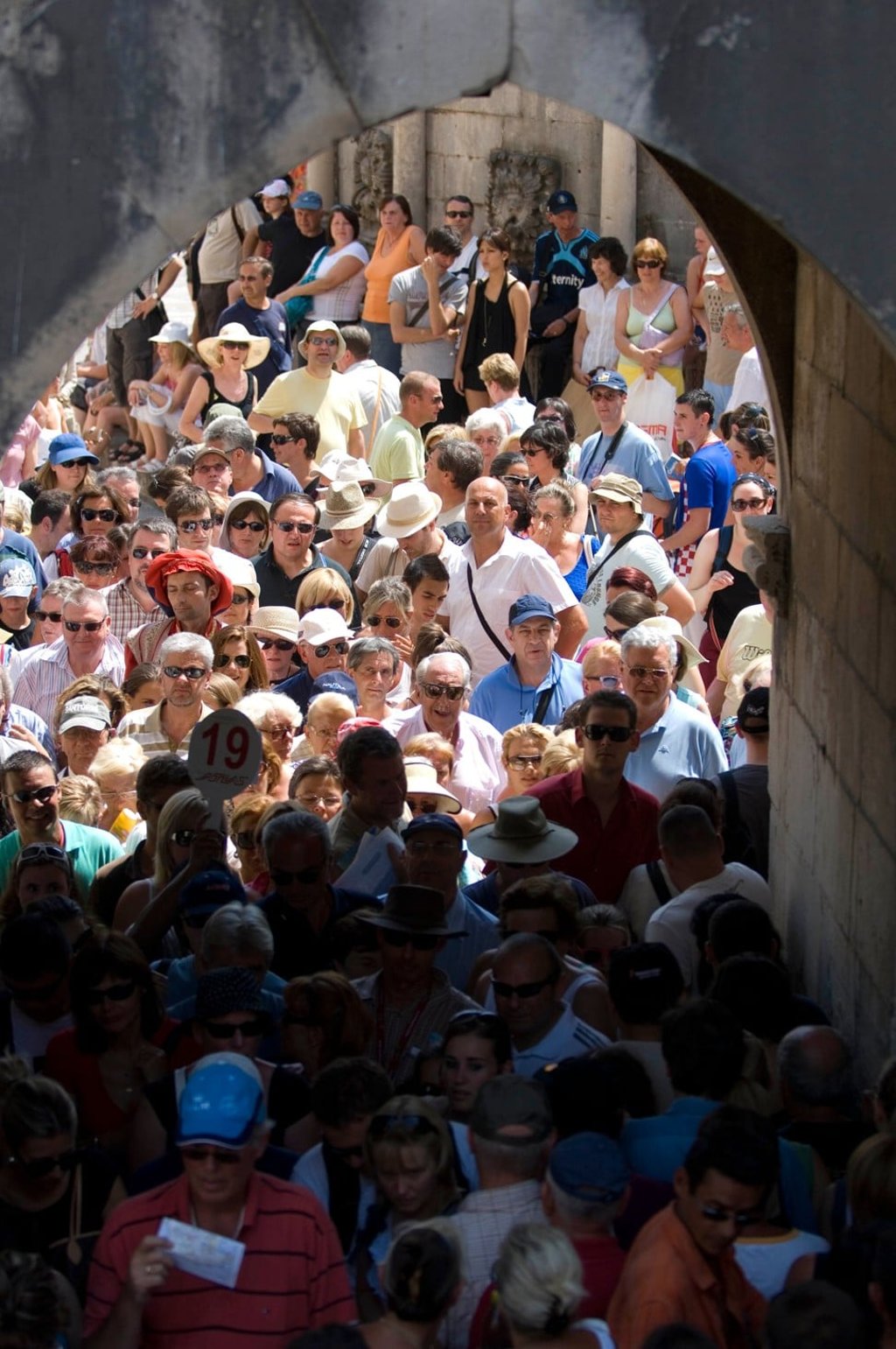 Tourists queue to get through the old arched entrance to Dubrovnik. Photo: Alamy
