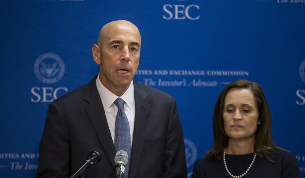 US Securities and Exchange Commission Co-Director of Enforcement Steven Peiken announces the decision to sue Tesla chief executive Elon Musk. Photo: AFP