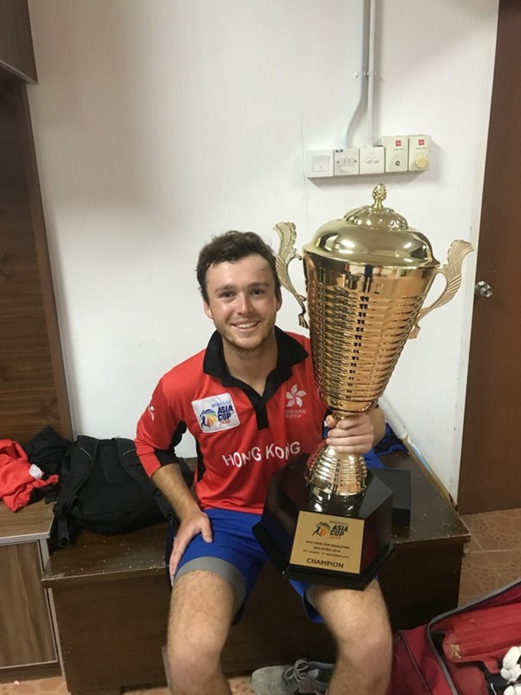 Chris Carter with the Asia Cup qualifier trophy.