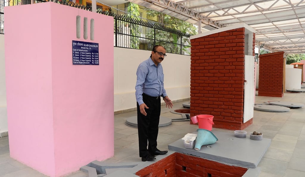 The Sulabh International Museum of Toilets scientist R.C Jha displays a toilet that can incinerate waste in New Delhi. Photo: AFP