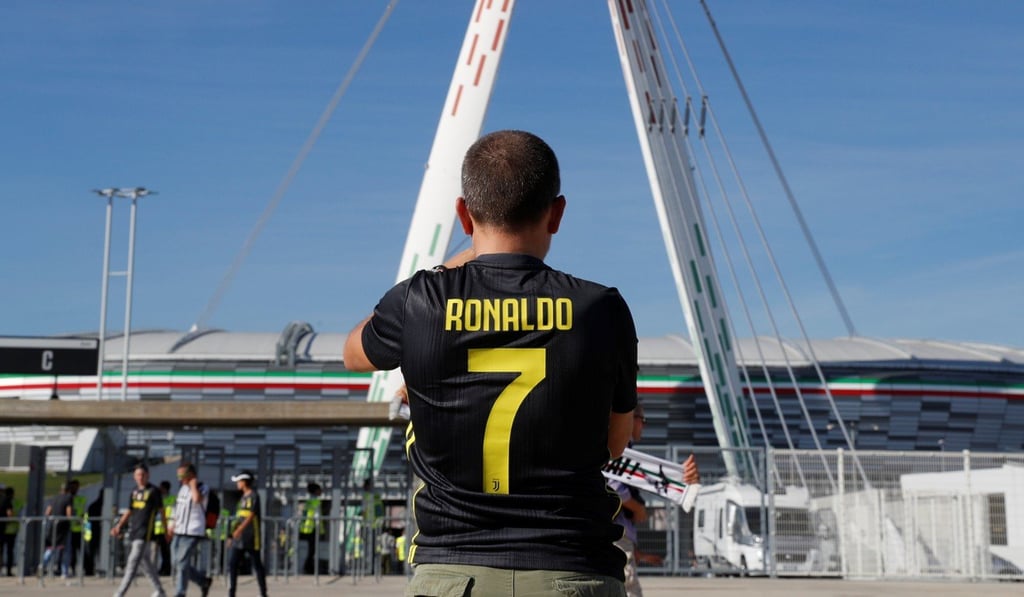 A Juventus fan wears a Cristiano Ronaldo shirt. Photo: Reuters