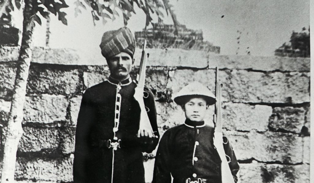 A circa 1900 picture of Indian and Chinese policemen in their respective uniforms.