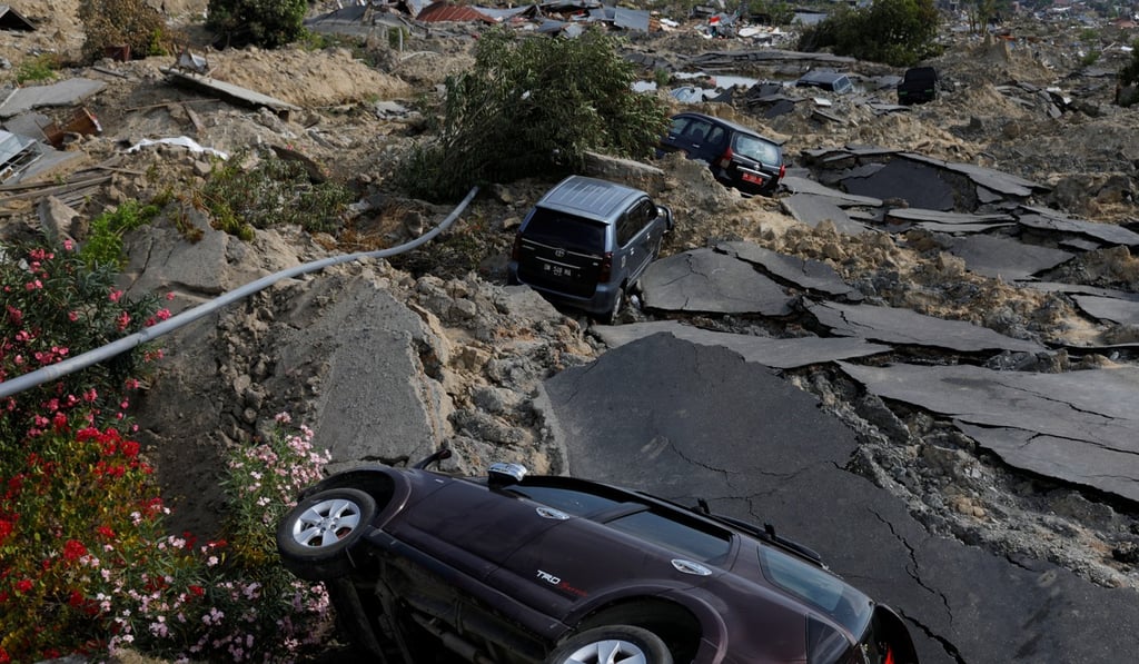 A mangled road in Palu, where services have started to return to normal. Photo: Reuters