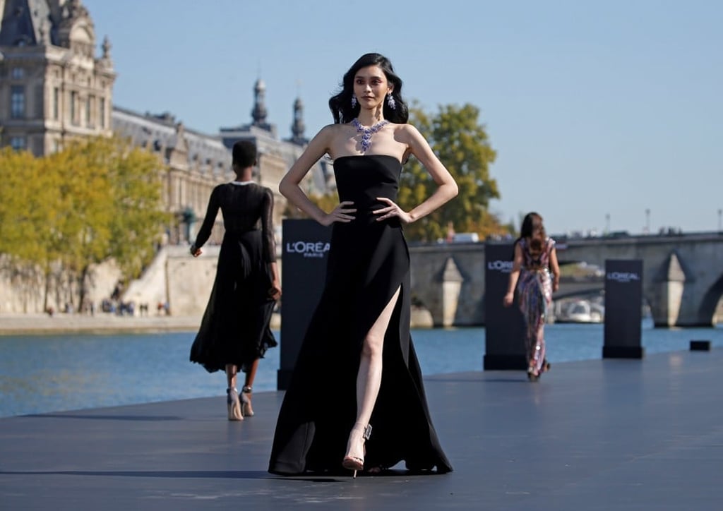 Supermodel Ming Xi presents a creation on a giant floating catwalk on the River Seine during Sunday’s Paris Fashion Week spring/summer 2019 collection show organised by French cosmetics company L’Oréal. Photo: Reuters