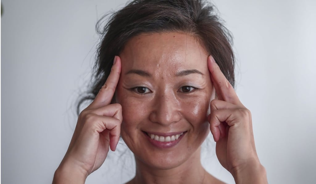 Hiyama practising a face yoga exercise. Photo: Jonathan Wong