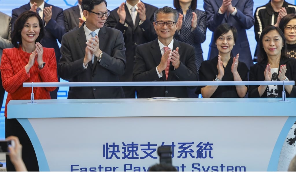 Guests officiate at the HKMA‘s Faster Payment System activation ceremony: (L-R) Mary Huen Wai-yi from Standard Chartered Bank; Norman Chan Tak-lam from HKMA; Paul Chan Mo-po, HK’s Financial Secretary; Diana Cesar from HSBC; and Ann Kung Yeung Yun-chi, Bank of China (Hong Kong). Photo: SCMP