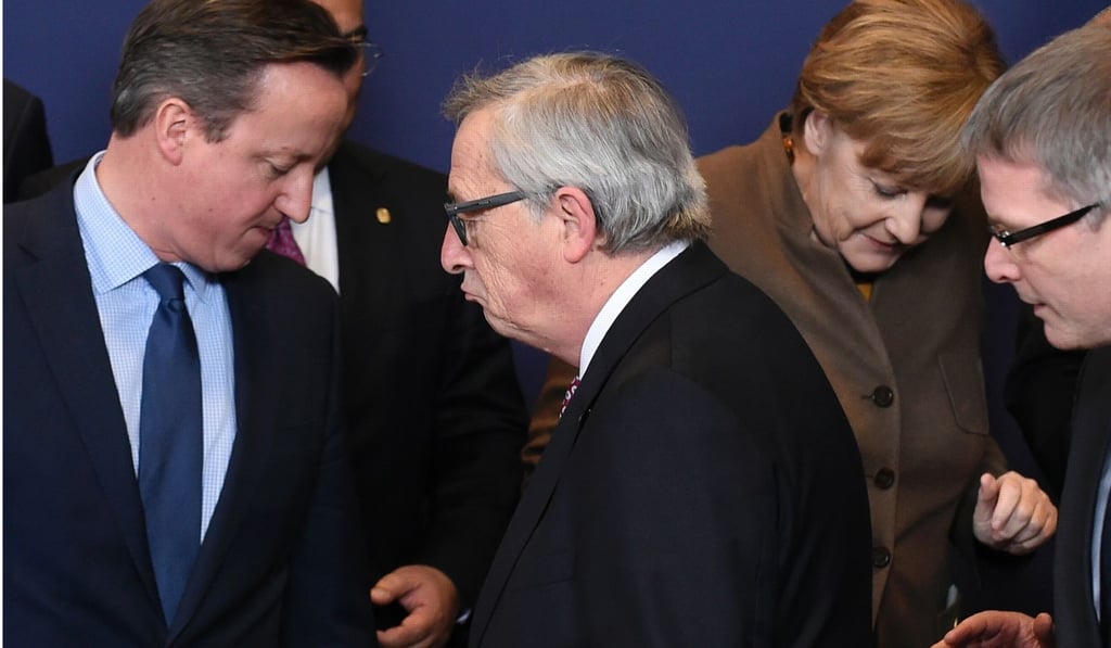 Britain’s former prime minister David Cameron (left), Juncker (C) and German Chancellor Angela Merkel line-up for a family photo during the European Summit at the EU’s headquarters in Brussels in February, 2016. Photo: AFP