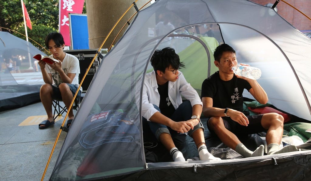 Hendrick Lui Chi-hang (left), Chinese University student, together with Polytechnic University students Lam Wing-hang and Yuen Pak-leung on hunger strike in Polytechnic University. Photo: Edmond So