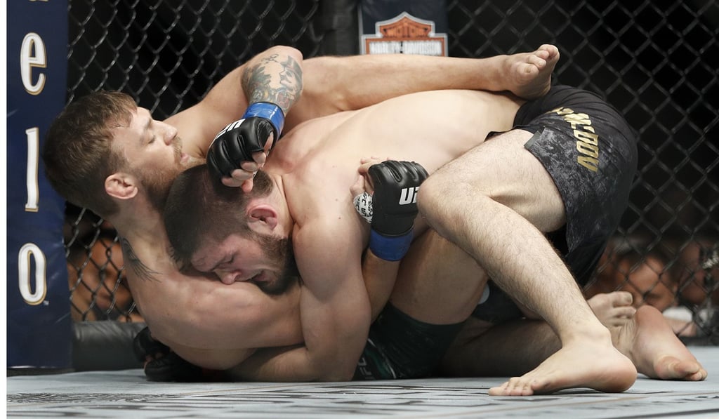 Conor McGregor and Khabib Nurmagomedov grapple. Photo: AP