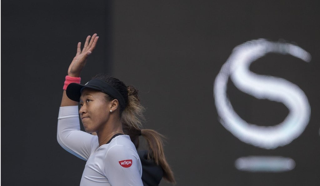 Naomi Osaka waves to the crowd in Beijing after her defeat by Anastasija Sevastova.Photo: Xinhua